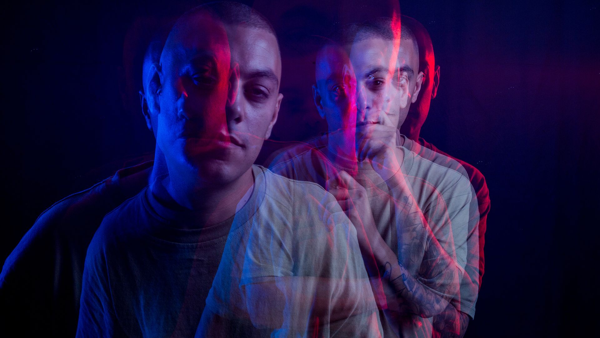 Ignacio Morales, multiple-exposure portrait lit in blue and magenta.